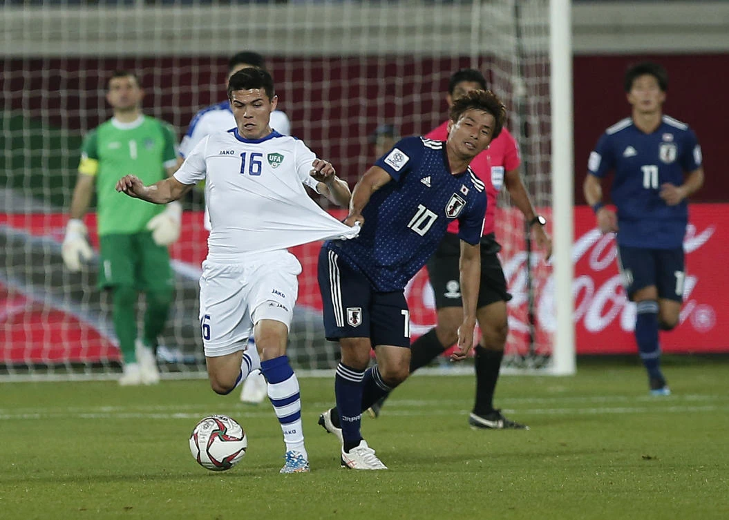 Much-changed Japan beat Uzbekistan to top Group F