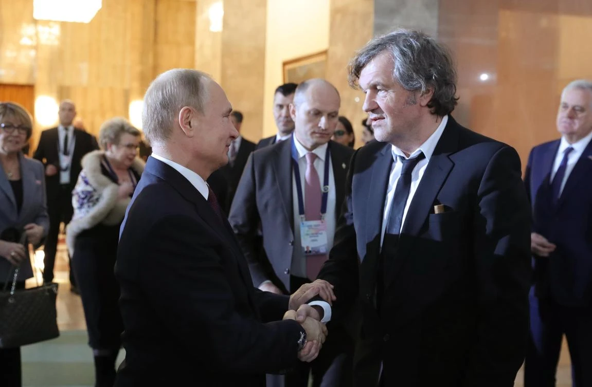 Russian President Vladimir Putin shakes hands with film director and musician Emir Kusturica, in Belgrade. Putin has recently stepped up efforts to restore Moscow’s influence in Eastern Europe. (Reuters)