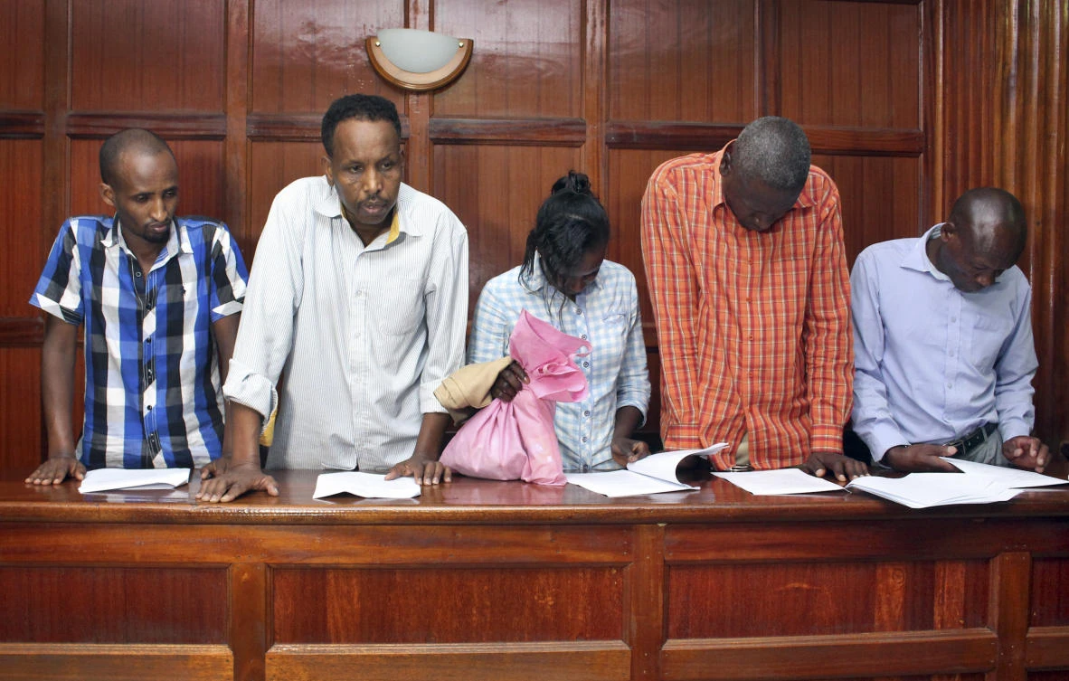 From left to right, suspects Osman Ibrahim, Guleid Abdihakim, Gladys Kaari Justus, Oliver Kanyango Muthee and Joel Nganga Wainaina appear at a hearing at Milimani law courts in Nairobi. (AP Photo)