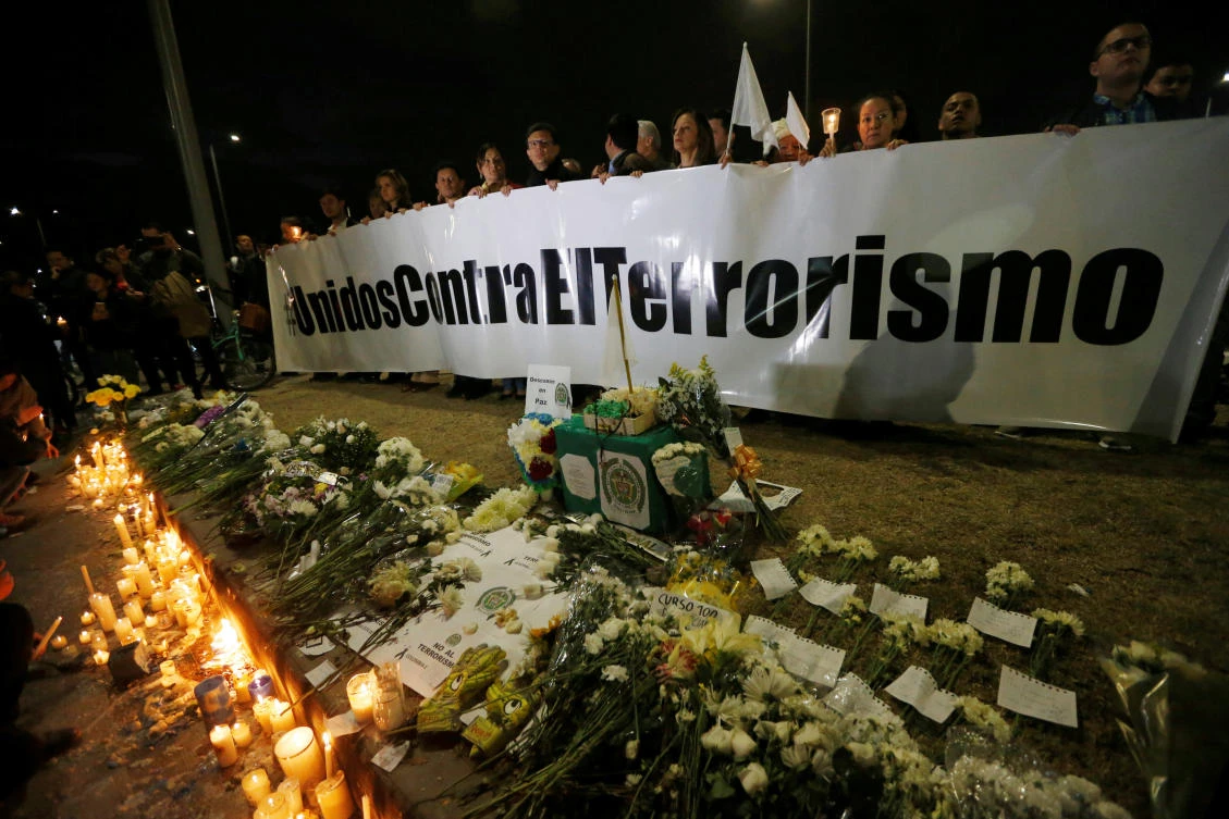 A sign that reads ‘United against terrorism’ at the scene where a car bomb exploded in Bogota on Friday, January 18. (Reuters)