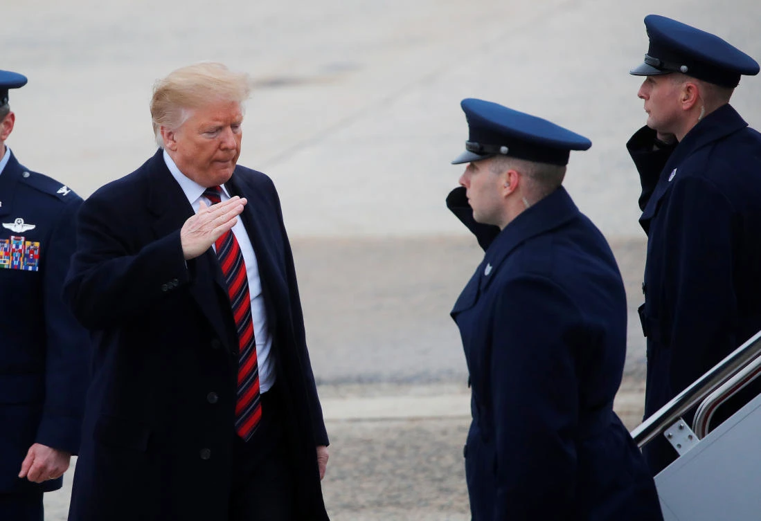 US President Donald Trump salutes US Air Force airmen as he boards Air Force One to travel to Dover Air Force Base to attend the dignified transfer ceremonies for the remains of members of the US military and US citizens killed during a recent attack in Syria as he departs from Joint Base Andrews, Maryland, US, January 19, 2019. (Reuters)