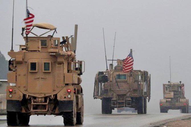 In this file photo taken on December 30, 2018, shows a line of US military vehicles in Syria's northern city of Manbij. (AFP)