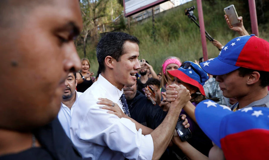 Juan Guaido, president of Venezuela's National Assembly, greets supporters during a gathering in Caracas on January 19, 2019. (REUTERS/Manaure Quintero)