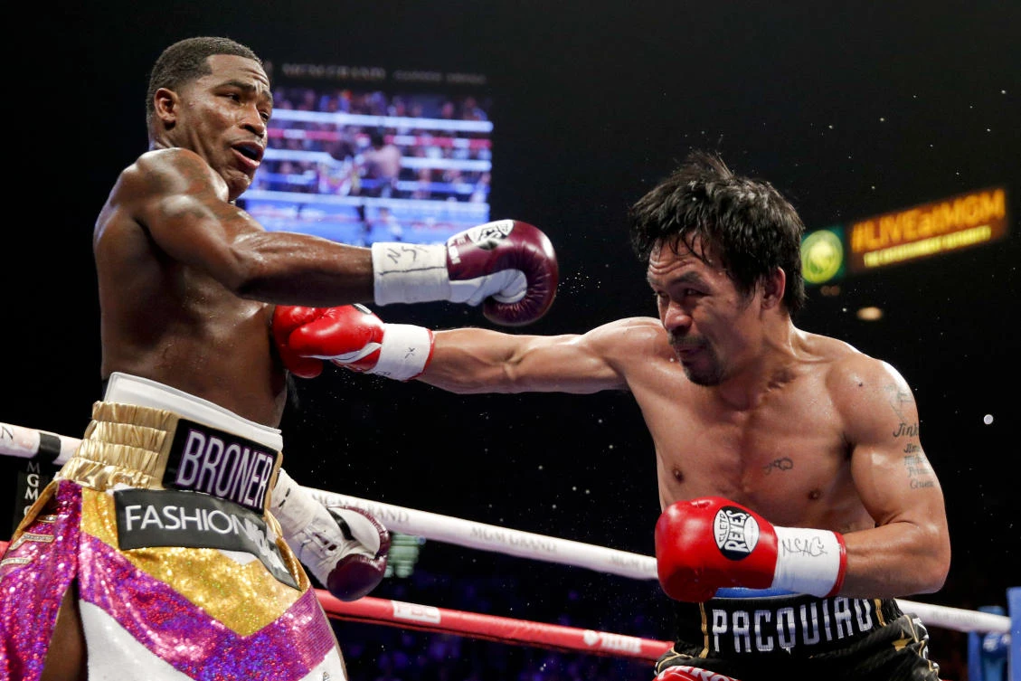 Manny Pacquiao, right, hits Adrien Broner during their WBA welterweight title boxing match Saturday, Jan. 19, 2019, in Las Vegas. (AP/John Locher)