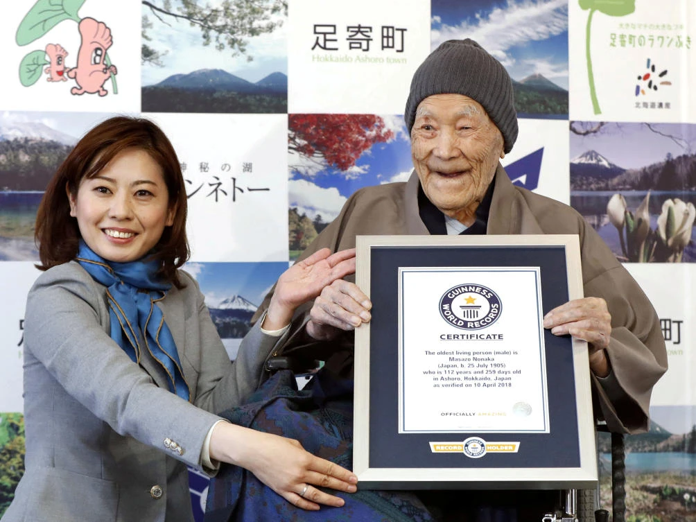 Masazo Nonaka receives a Guinness World Records certificate naming him the world's oldest man during a ceremony on April 10, 2018. (Kyodo via Reuters)