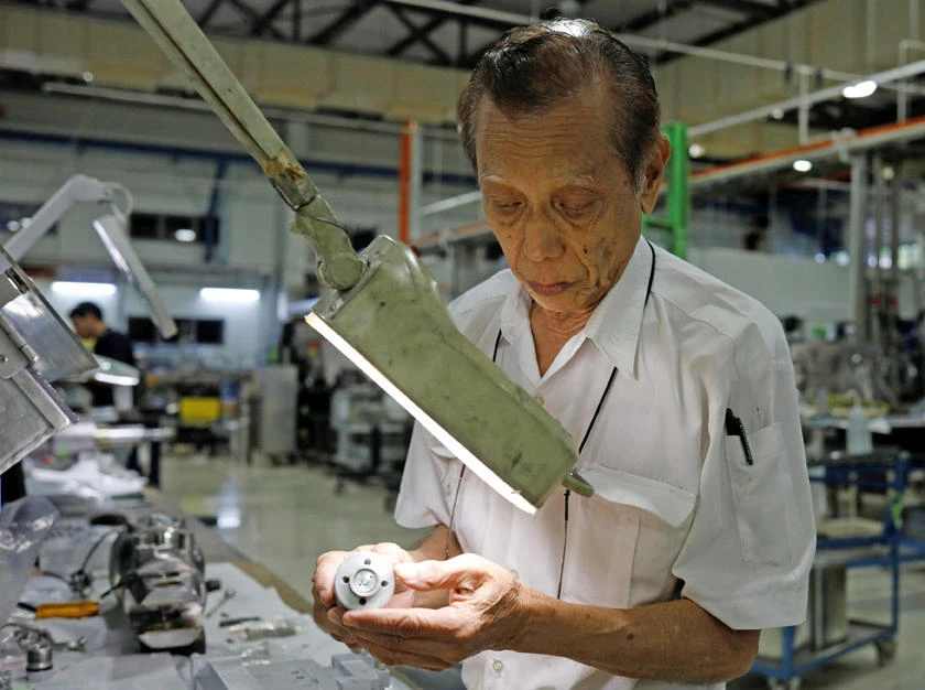 Mohamad Mohsin Khan, 74, assembles aircraft parts at ACE Services in Singapore on December 17, 2018. (REUTERS/Edgar Su)