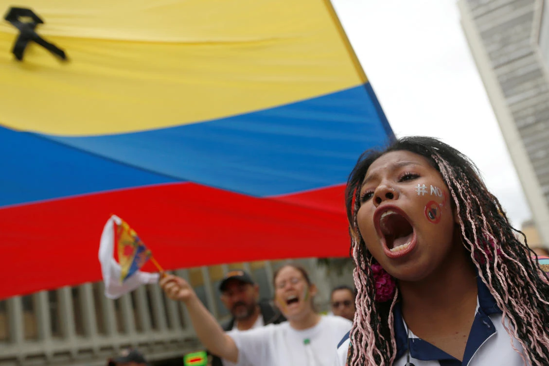 People take part in a rally against violence following a car bombing against a police academy that left 21 dead and dozens more wounded. (Reuters)