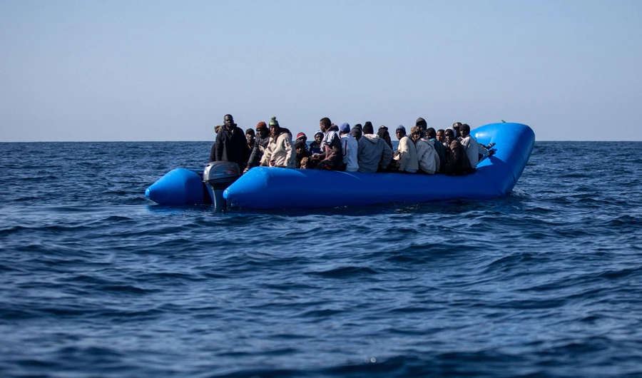 An unflatable boat with 47 migrants on board is pictured while being rescued by the Dutch-flagged Sea Watch 3 off Libya's coasts on Jan. 19, 2019. (AFP)