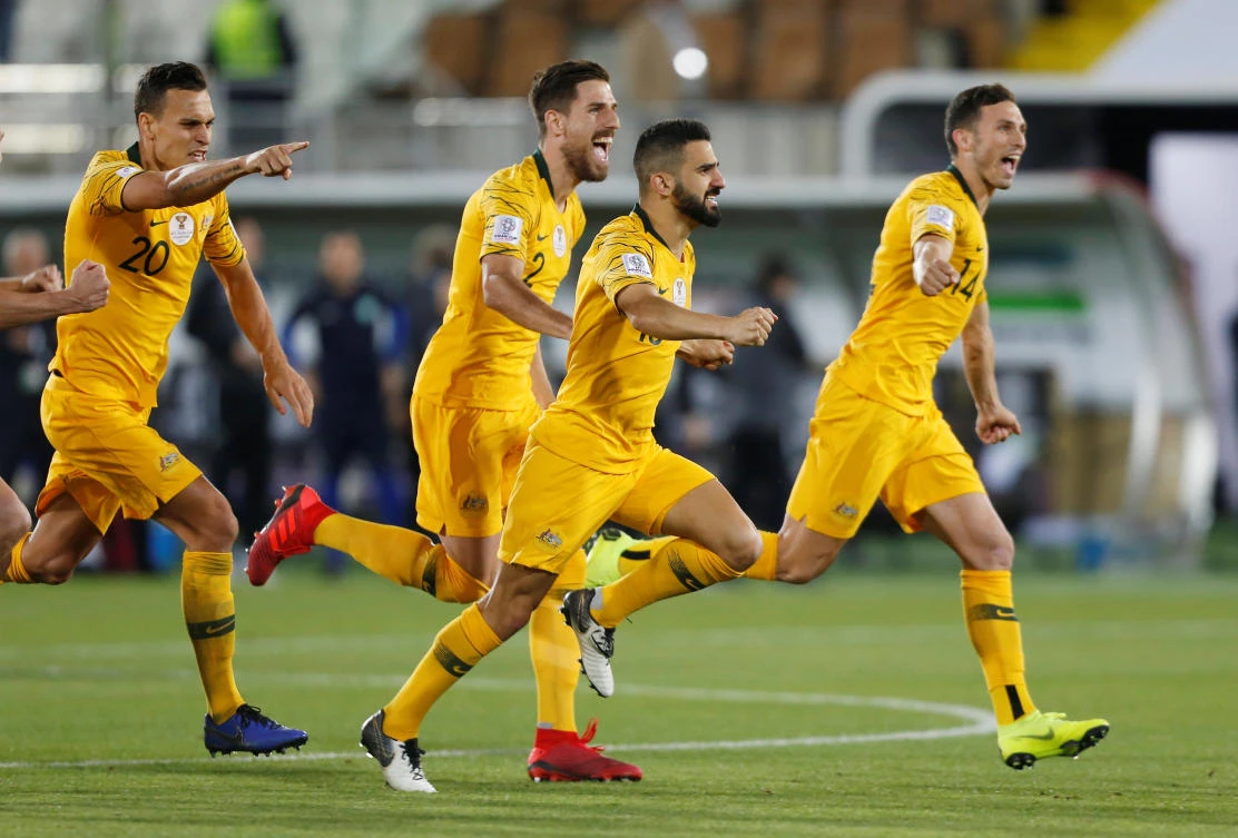 Uzbekistan pay the penalty as Australia hold nerve to reach last-eight
