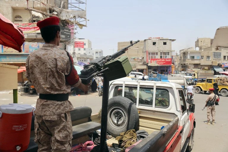 Yemeni army personnel killed eight Houthis on Tuesday during clashes in Taiz. Above, a Yemeni military policeman patrols a street in Taiz in 2018. (AFP)