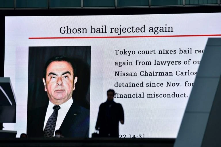 Former Nissan chairman Carlos Ghosn has been charged with falsifying financial reports in underreporting his compensation and with breach of trust. (AFP)