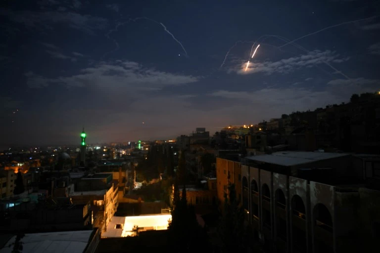 Syrian air defense batteries respond to Israeli missiles targeting Damascus. (AFP)