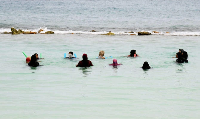 In this file photo taken on February 07, 2018, a group of women bathe at an artificial beach in the Maldives capital Male. Six tourists, including a Filipino honeymoon couple, drowned in the upmarket holiday destination of the Maldives this month making it the worst for swimming and diving-related tragedies, officials said on January 22, 2019. (AFP)