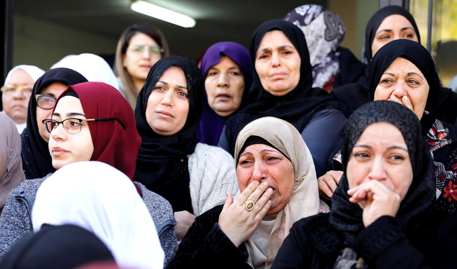 Mourners cry during the funeral of Arab-Israeli student Aya Maasarwe in the Arab-Israeli town of Baqa Al-Gharbiya on Wednesday. (AFP)