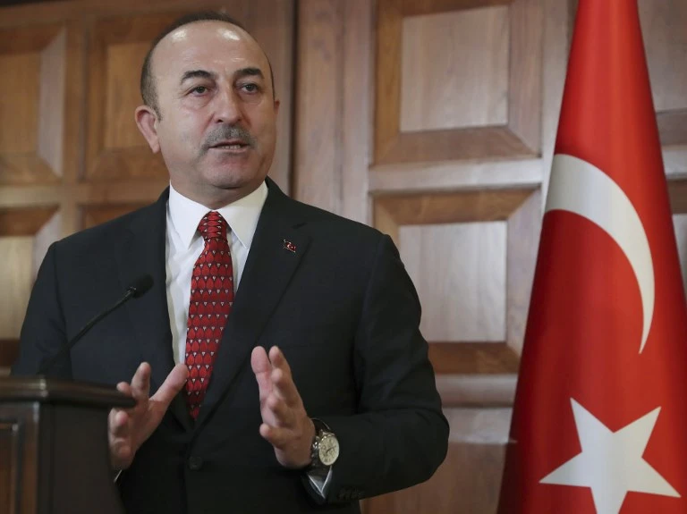 The Turkish Foreign Minister Mevlut Cavusoglu, above, says they are on the same page with Russia, except on the issue of Al-Assad staying in office. (AFP)