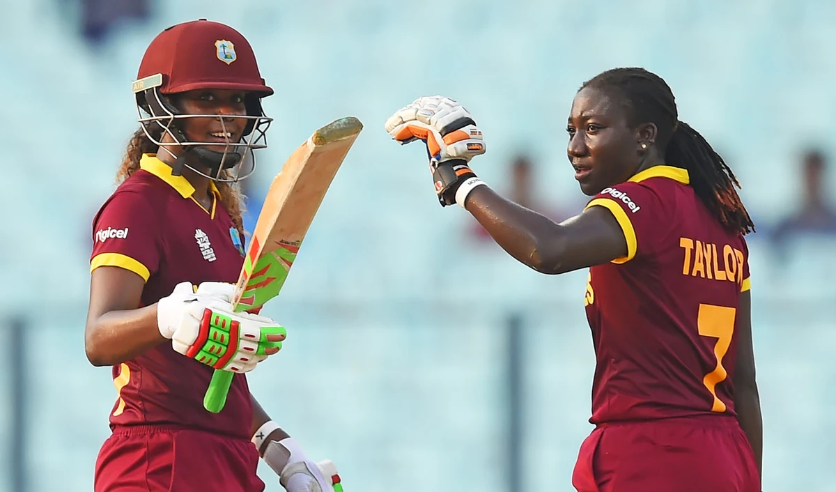 In this file photo, West Indies's Stafanie Taylor, right, looks on as Hayley Matthews celebrates after scoring a half-century (50 runs) during the World T20 cricket tournament women's final match between Australia and West Indies in Kolkata on April 3, 2016. (AFP)