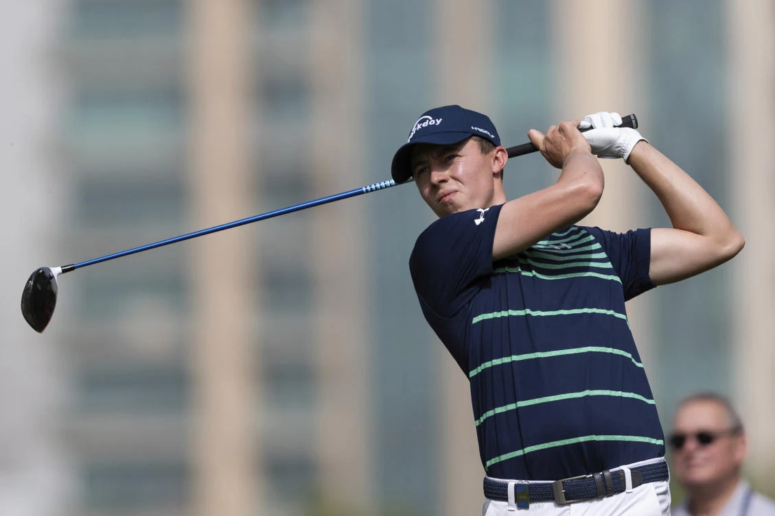 Matthew Fitzpatrick of England tees off on the 5th hole during round one of the Dubai Desert Classic golf tournament, in Dubai, United Arab Emirates. (AP Photo)