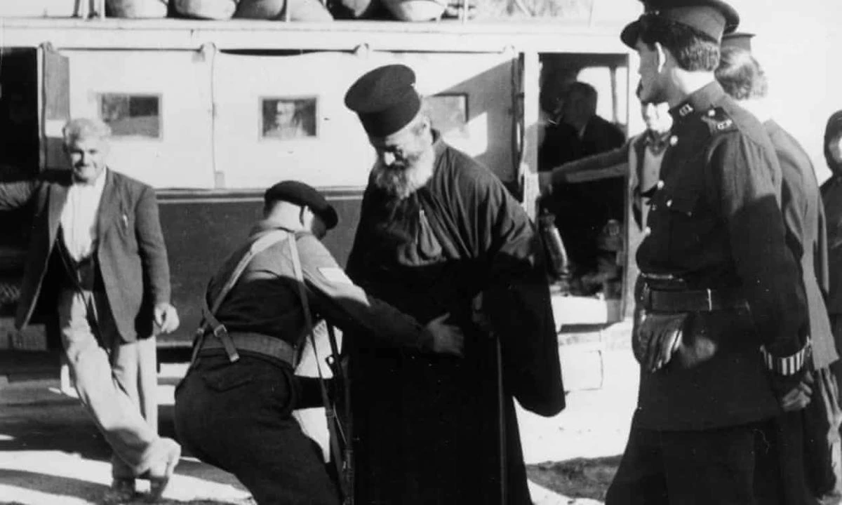 British soldiers search a Greek Orthodox priest in Cyprus in 1955. (Getty Images)