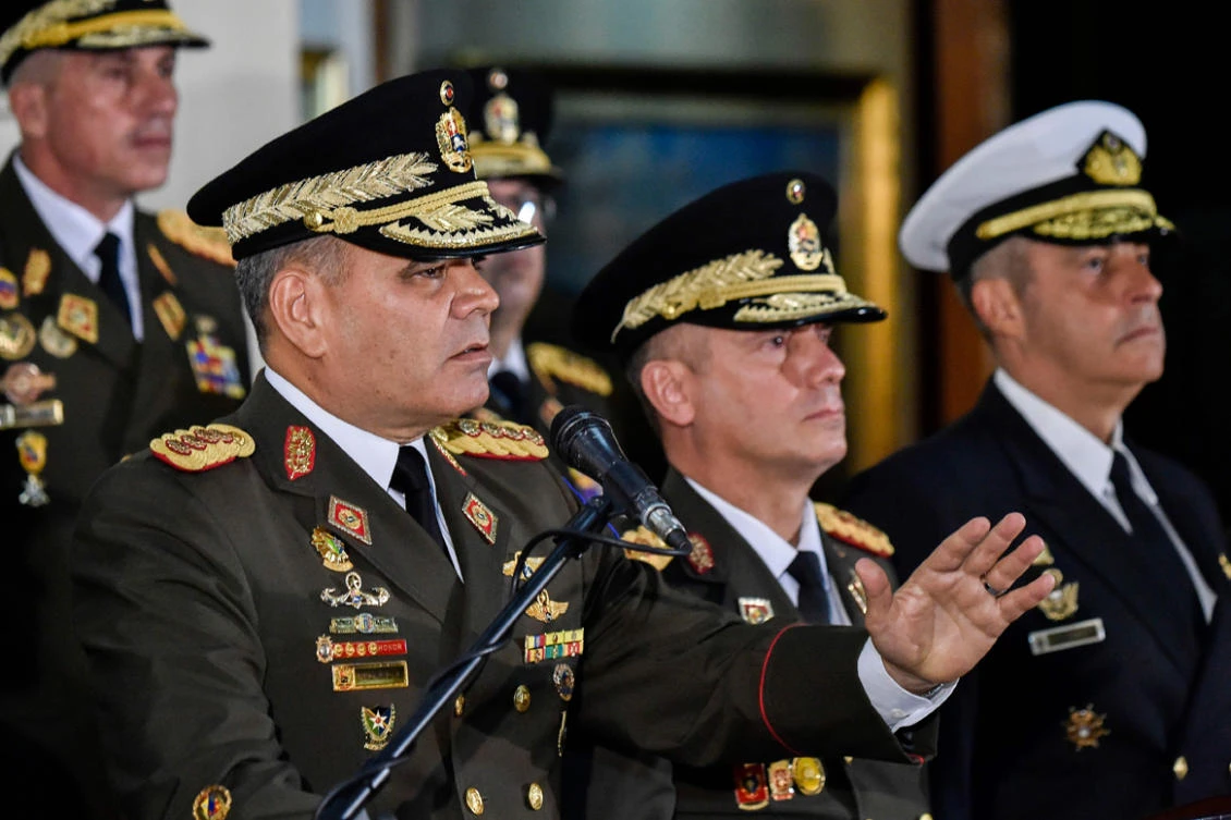 Venezuelan Defense Minister Vladimir Padrino Lopez (L) delivers a press conference in Caracas, along with members of the top military leadership "in support of the constitutional president", Nicolas Maduro on January 24, 2019. (AFP / Luis Robayo)