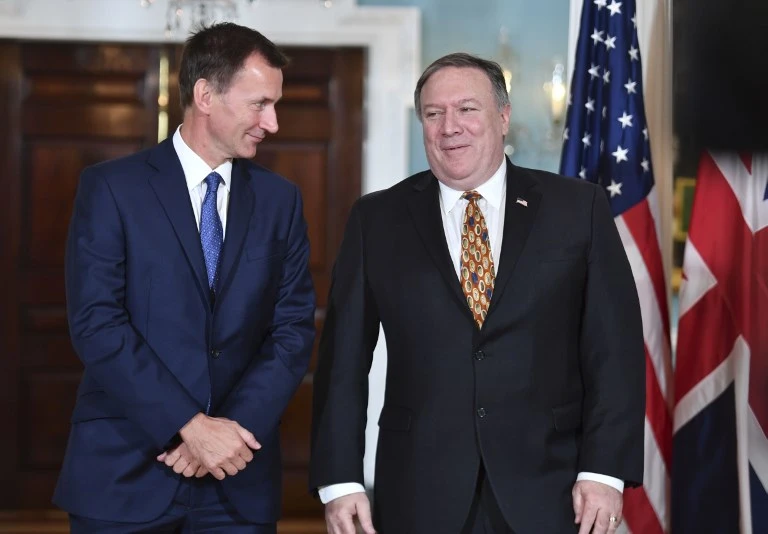 US Secretary of State Mike Pompeo greets British Foreign Secretary Jeremy Hunt (L) prior to meetings at the State Department in Washington, DC, August 22, 2018. (AFP)