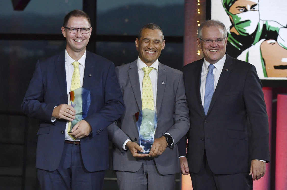 Prime Minister Scott Morrison, right, with 2019 Australians of the Year Dr. Richard Harris, left, and Craig Challen during the awards ceremony on Friday, January 25, in Canberra. (AAP Image via AP)