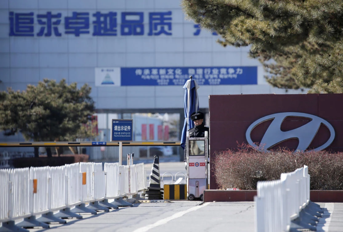 A security guard is seen at the main entrance of a plant of Hyundai Motor Co. on the outskirts of Beijing, China on Jan. 25, 2019. (Reuters)