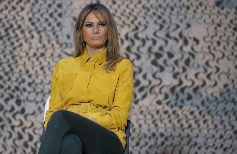 First Lady Melania Trump sits onstage as US President Donald Trump speaks to members of the US military during an unannounced trip to Al Asad Air Base in Iraq on December 26, 2018. (AFP)
