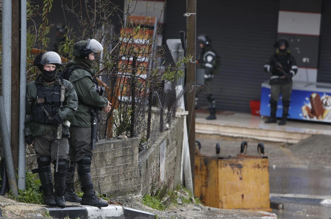 In this Wednesday, Jan. 9, 2019 file photo, Israeli forces deploy during a raid in the West Bank City of Ramallah. Israel has been launching raids into the heart of Ramallah, and the US is cutting off aid and taking actions that many fear will obliterate any remaining hope for a two-state solution. (AP)