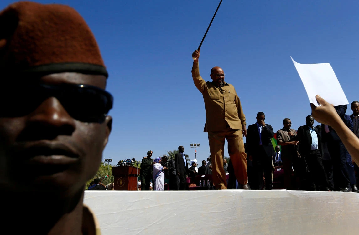 Sudan’s President Omar Al-Bashir waves to his supporters during a rally at the Green Square in Khartoum on January 9. (Reuters)
