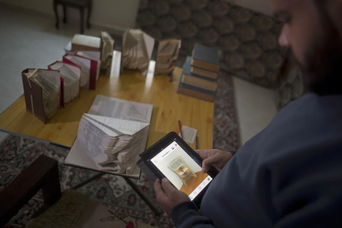 Palestinian artist Ahmed Humaid would like to expand his business beyond Gaza’s borders, but the blockade has cut off virtually all exports. (AP)