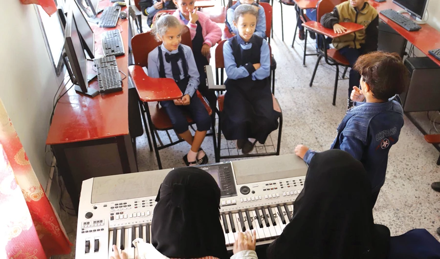 Children attend a music class at the Al-Nawras school in Taez, Yemen's third city, in the country's southwest, on Wednesday. (AFP)