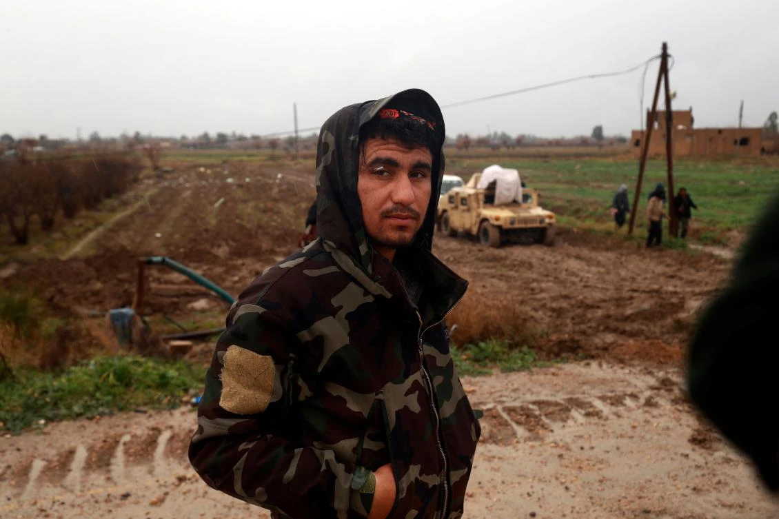 A fighters from the Syrian Democratic Forces (SDF) looks towards the camera on January 28, 2019, in the town of Sousa, in Syria's eastern province of Deir Ezzor. Kurdish-led fighters pressed their assault against Daesh in eastern Syria Monday. (AFP)