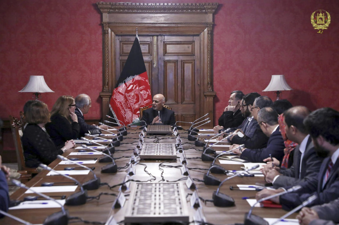 Afghan President Ashraf Ghani, center, discusses with US peace envoy Zalmay Khalilzad, third left, at the presidential palace in Kabul negotiations for a peace deal with the Taliban. (Afghan Presidential Palace via AP)