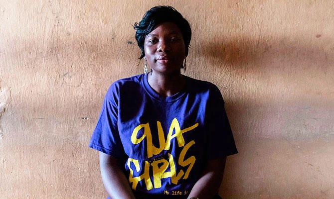 A "9ja Girls" councilor poses for a photo at the Bada Primary Health Centre in Lagos on November 11, 2018. (AFP)