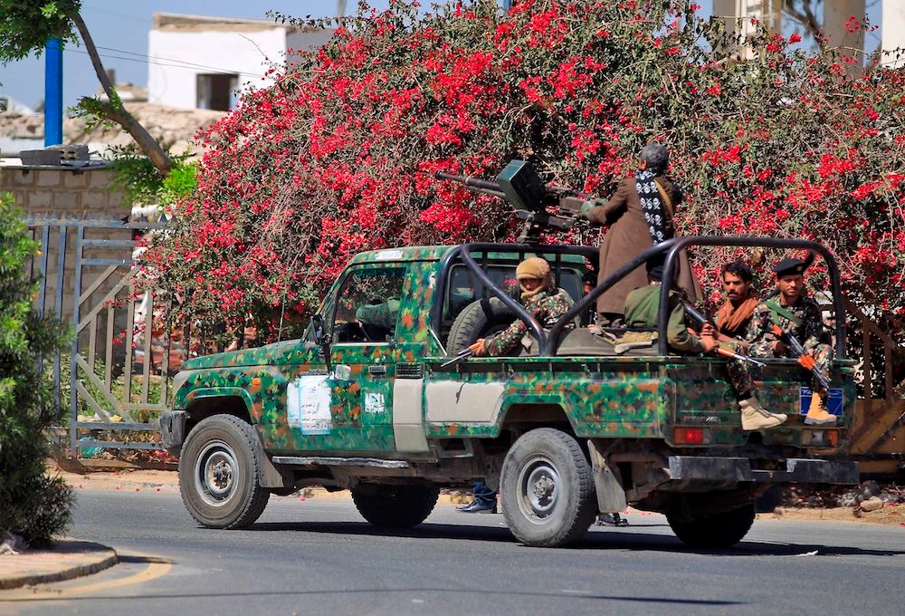 Houthi militants on Thursday patrolling the streets of Sanaa, which they seized from the government in 2014. (AFP)
