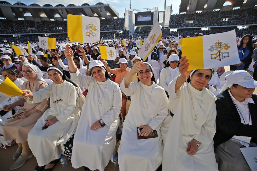Christian worshippers attend a mass, led by Pope Francis, at the Zayed Sports City Stadium. (AFP)