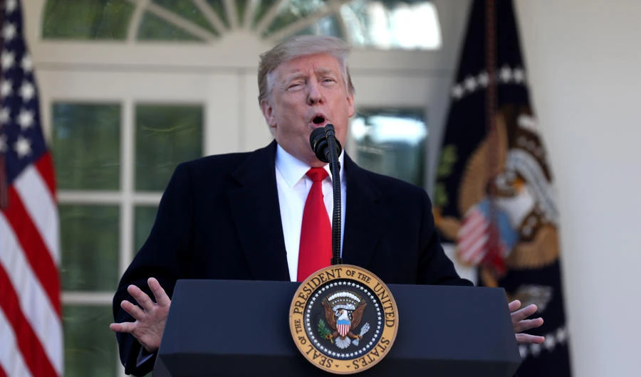 US President Donald Trump blames media as he reverses his stand on the assessment of the intelligence service on the country's security concerns. (AFP / Alex Edelman