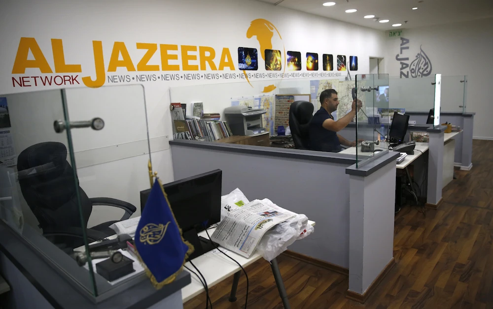 NewsGuard has urged readers to “proceed with extreme caution” when disseminating any output of the channel Al-Jazeera English. (AFP)
