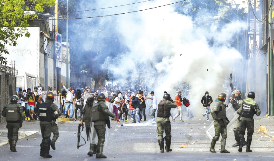 Lebanon has had its share of street unrest over the years, but protests in Venezuela this year are making it seem the more appealing option. (AFP)