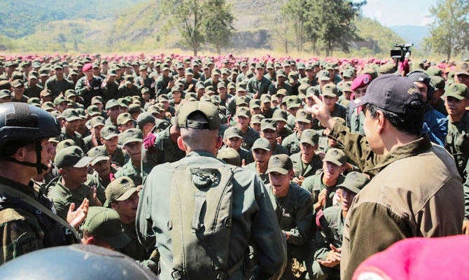 This handout photo released by the Venezuelan Presidency press office shows President Nicolas Maduro (R) attending military excercices at the Bolivarian National Guard Command in Macarao, Caracas, on February 1, 2019. (AFP)