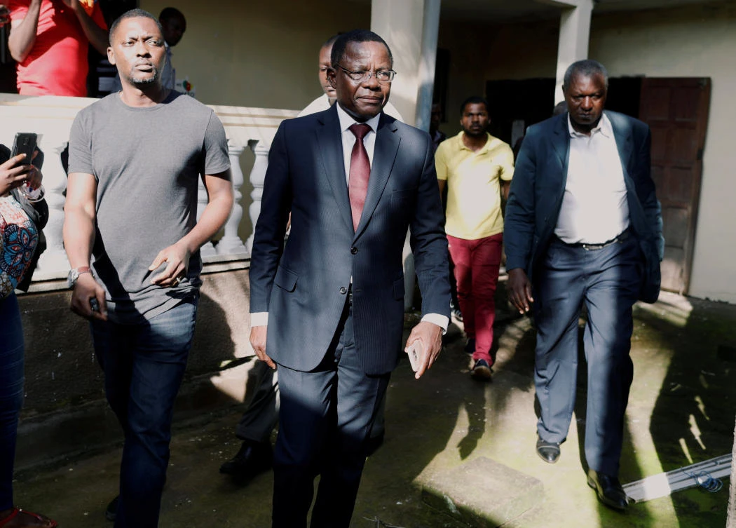 Former government minister and opposition leader Maurice Kamto, center, who claims to have been cheated out of the presidency, was arrested in the economic capital Douala on Monday. (Reuters)