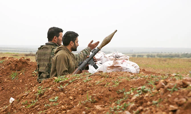 Turkish-backed Syrian fighters keep position near the town of Tal Hajar in Syria's northern Aleppo province, a few kilometres from areas controlled by a Kurdish-led coalition, on February 1, 2019. (AFP)