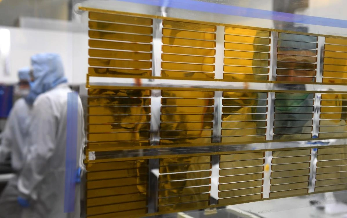Experimental solar panels hang in the window of a Saule company laboratory in Wroclaw on January 16, 2019. (AFP)