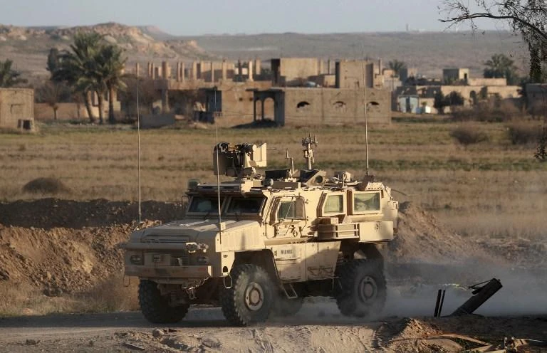 A US military vehicle drives through in the countryside of eastern Deir Ezzor province on January 26, 2019. (AFP)