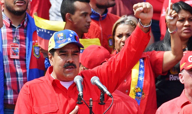 Venezuelan President Nicolas Maduro gestures during a gathering to mark the 20th anniversary of the rise of power of the late Hugo Chavez, the leftist firebrand who installed a socialist government, in Caracas on February 2, 2019. (AFP)