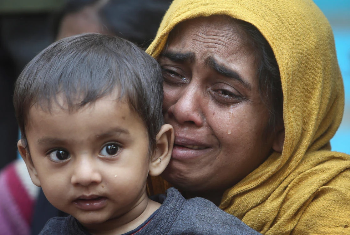 A Rohingya Muslim woman cries as she holds her daughter after they were detained by Border Security Force (BSF) soldiers while crossing the India-Bangladesh border from Bangladesh, at Raimura village on the outskirts of Agartala, January 22, 2019. (Jayanta Dey/Reuters)