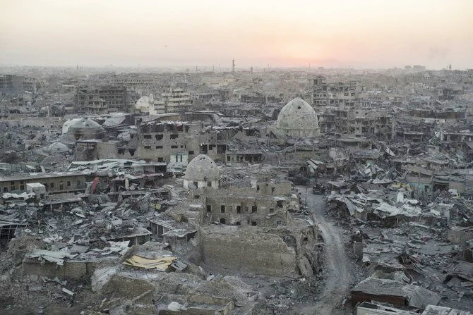 The sun sets behind destroyed buildings in the west side of Mosul, Iraq. (AP)