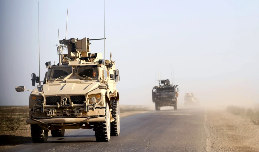 US armoured vehicles patrolling in the countryside of the eastern Syrian Deir Ezzor province. (AFP)