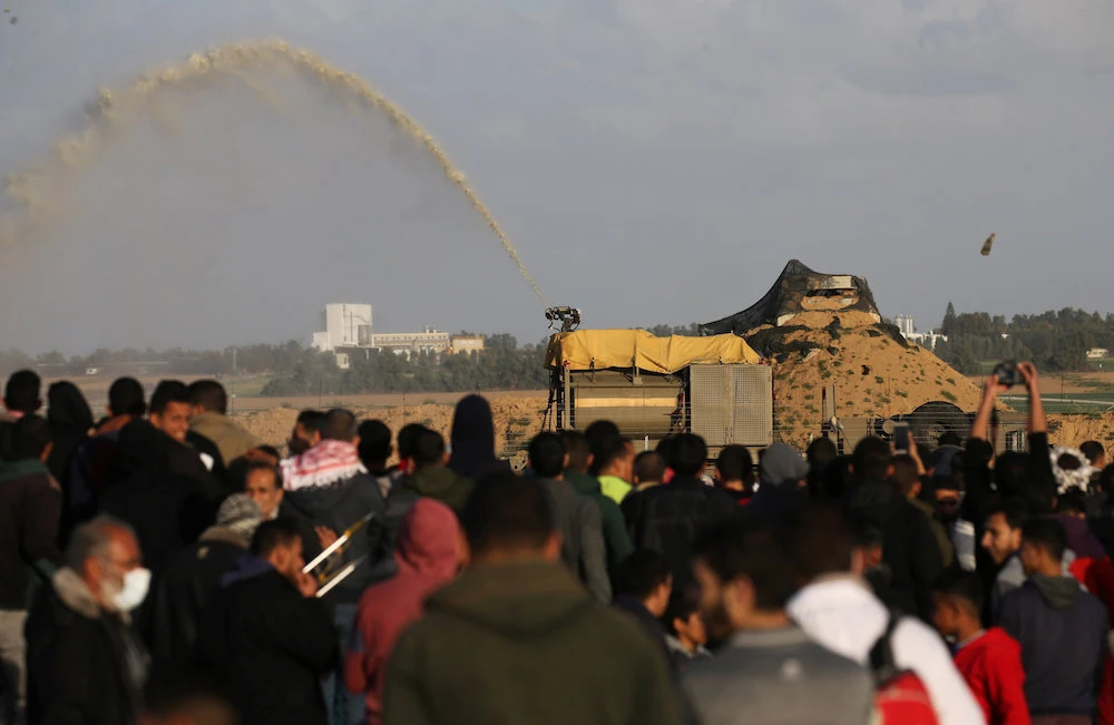 Israeli forces fire a foul smelling substance at Palestinian demonstrators during a protest near the Israel-Gaza border fence, in the southern Gaza Strip February 8, 2019. (Reuters)