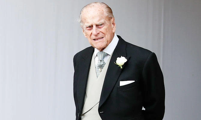 In this Friday, Oct. 12, 2018 file photo, Britain's Prince Philip waits for the bridal procession following the wedding of Princess Eugenie of York and Jack Brooksbank in St George's Chapel, Windsor Castle, near London, England. (AP)